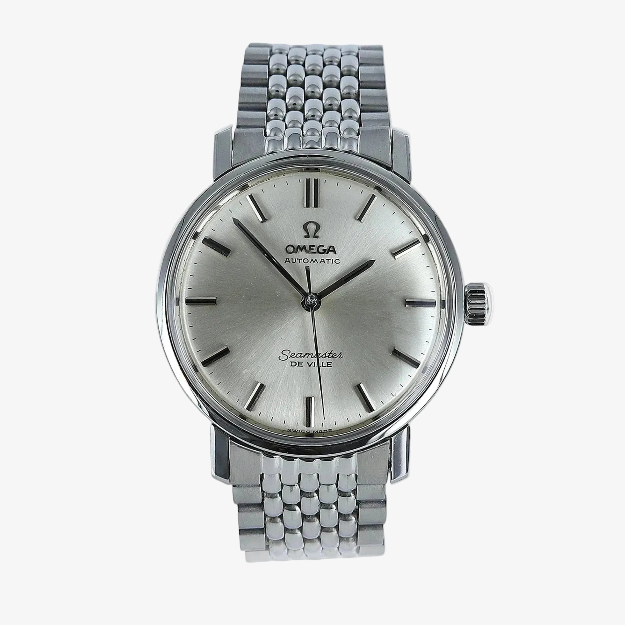 Omega Seamaster De Ville automatic watch with a silver dial and a stainless steel multi-link bracelet, shown against a light gray background.